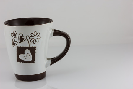 White coffee cup with a handle isolate on white backgroundの写真素材