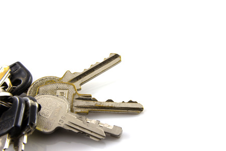Large bunch of keys isolate on white backgroundの写真素材