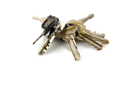 Large bunch of keys isolate on white background