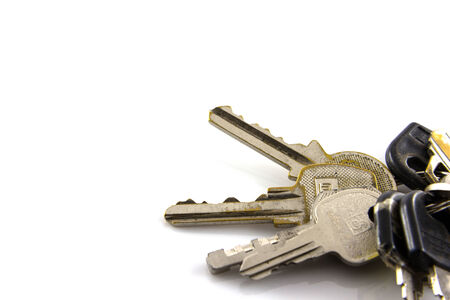 Large bunch of keys isolate on white backgroundの写真素材