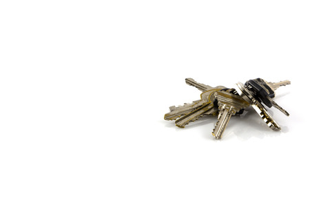 Large bunch of keys isolate on white backgroundの写真素材