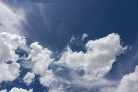 Thick cloud over blue sky on a sunny dayの写真素材