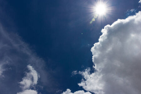 Thick cloud over blue sky on a sunny dayの写真素材