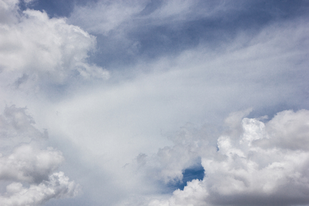 Thick cloud over blue sky on a sunny dayの写真素材