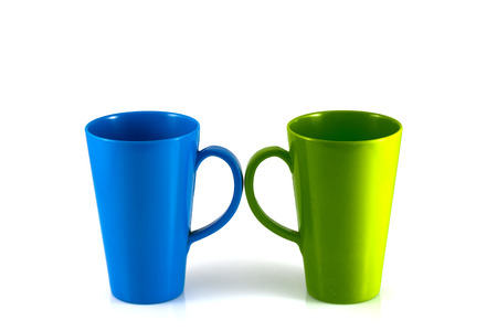 Green and blue cup isolate on white backgroundの写真素材