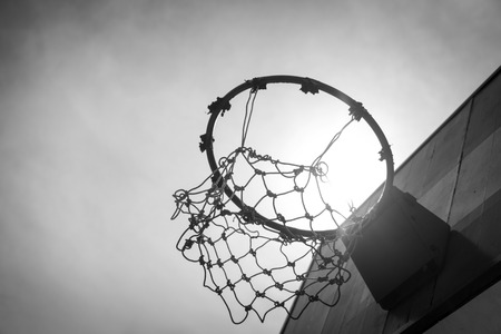 Wooden basketball hoop during sunset.の写真素材