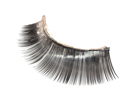 Use artificial eyelashes macro Isolated on ,Through the use of eyelashesの写真素材