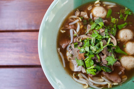 bowl of pungent thai pork noodle soupの写真素材
