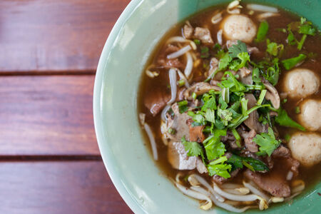 bowl of pungent thai pork noodle soupの写真素材