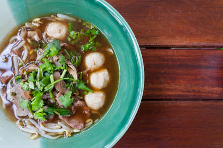 bowl of pungent thai pork noodle soupの写真素材