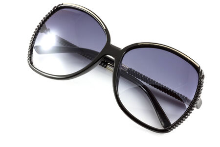 Black fashion sunglasses isolate on whiteの写真素材