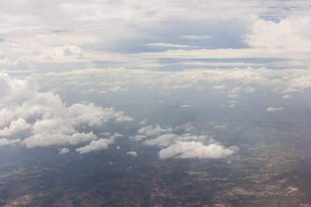 Blue sky with clouds background on the airplanの写真素材