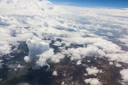 Blue sky with clouds background on the airplanの写真素材