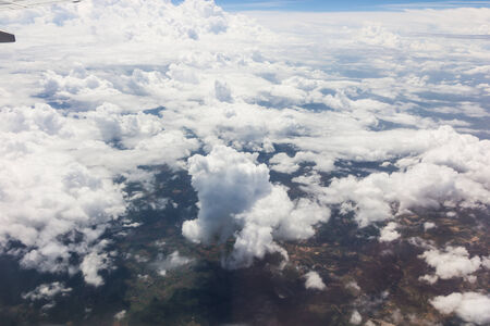 Blue sky with clouds background on the airplanの写真素材