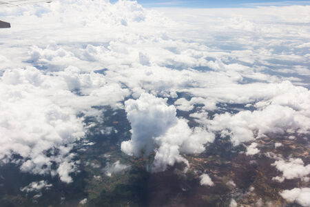 Blue sky with clouds background on the airplanの写真素材