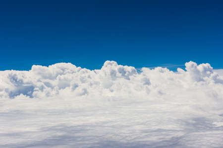 Blue sky with clouds background on the airplan in the morning timeの写真素材