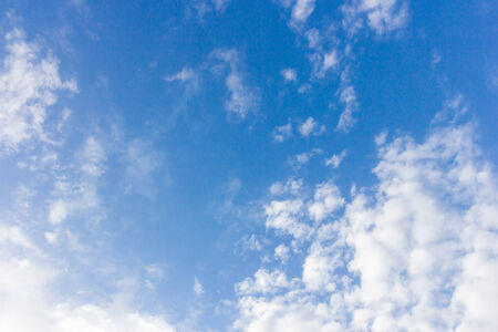 Blue sky with clouds backgroundの写真素材