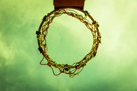 Wooden basketball hoop during sunset.の写真素材
