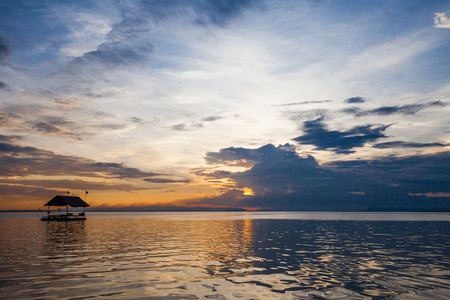 Pontoon floating in the water at sunsetの写真素材