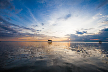Pontoon floating in the water at sunsetの写真素材
