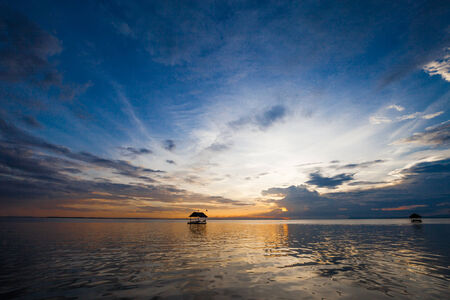 Pontoon floating in the water at sunsetの写真素材