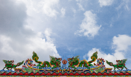 Chinese dragon on the roof with blue skyの写真素材