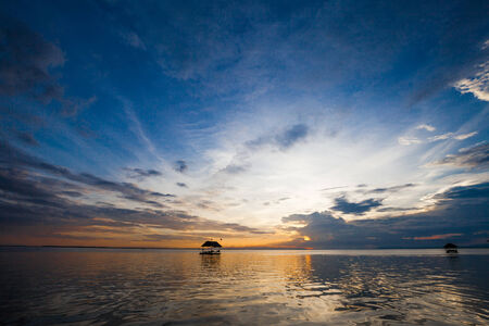 Pontoon floating in the water at sunsetの写真素材