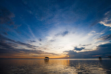 Pontoon floating in the water at sunsetの写真素材