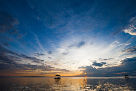 Pontoon floating in the water at sunsetの写真素材