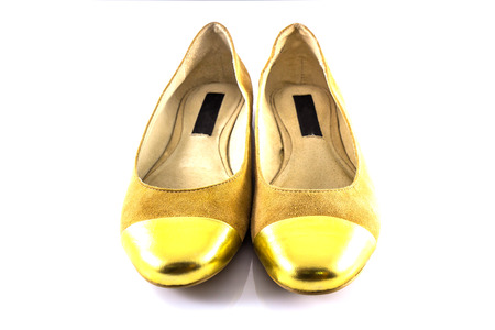 Brown and Gold Shoes on white backgroundの写真素材