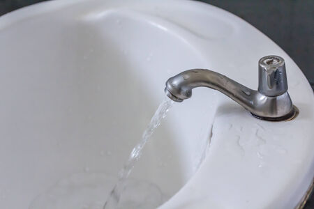 water tap in the restroom. Flowing water outの写真素材