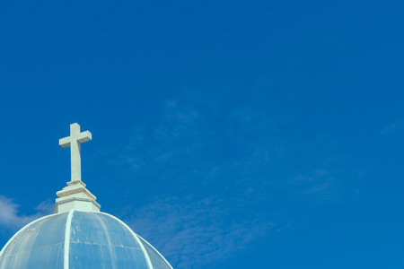 big white cross on blue skyの写真素材
