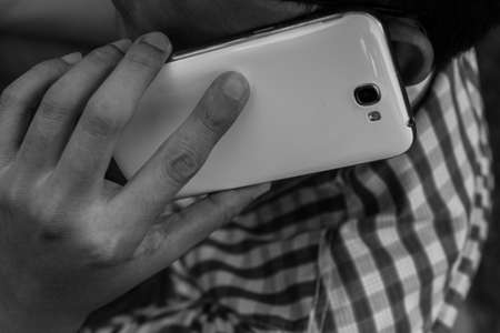 Close up man using mobile smart phone  backgroundの写真素材