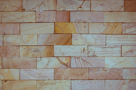 stone wall made with blocks backgroundの写真素材