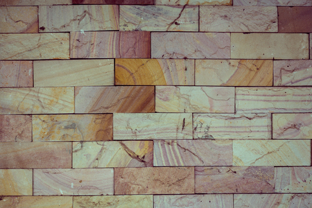 stone wall made with blocks backgroundの写真素材