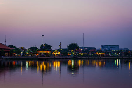 sunset of city on the park with reflections water silhouetteの写真素材