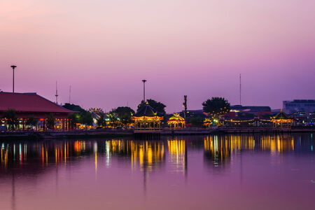 sunset of city on the park with reflections water silhouetteの写真素材