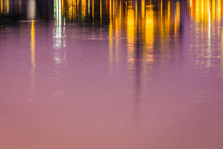 sunset of city on the park with reflections water silhouetteの写真素材