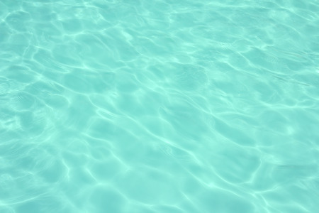 swimming pool with sunny reflections の写真素材