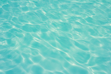 swimming pool with sunny reflections の写真素材