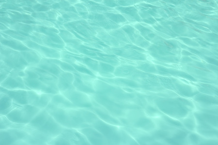 swimming pool with sunny reflections の写真素材