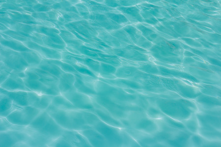 swimming pool with sunny reflections backgroundの写真素材