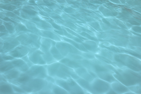 swimming pool with sunny reflections backgroundの写真素材