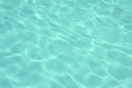 swimming pool with sunny reflections backgroundの写真素材