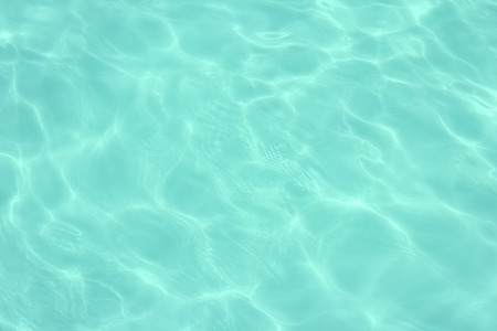 swimming pool with sunny reflections の写真素材