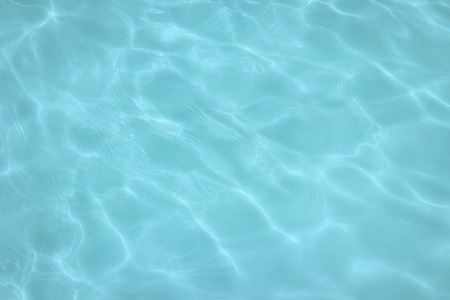swimming pool with sunny reflections の写真素材