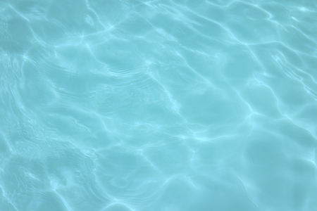 swimming pool with sunny reflections の写真素材