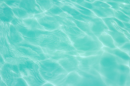 swimming pool with sunny reflections の写真素材