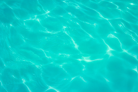 swimming pool with sunny reflections の写真素材