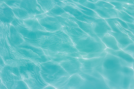 swimming pool with sunny reflections の写真素材
